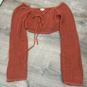 Burnt orange knit top.